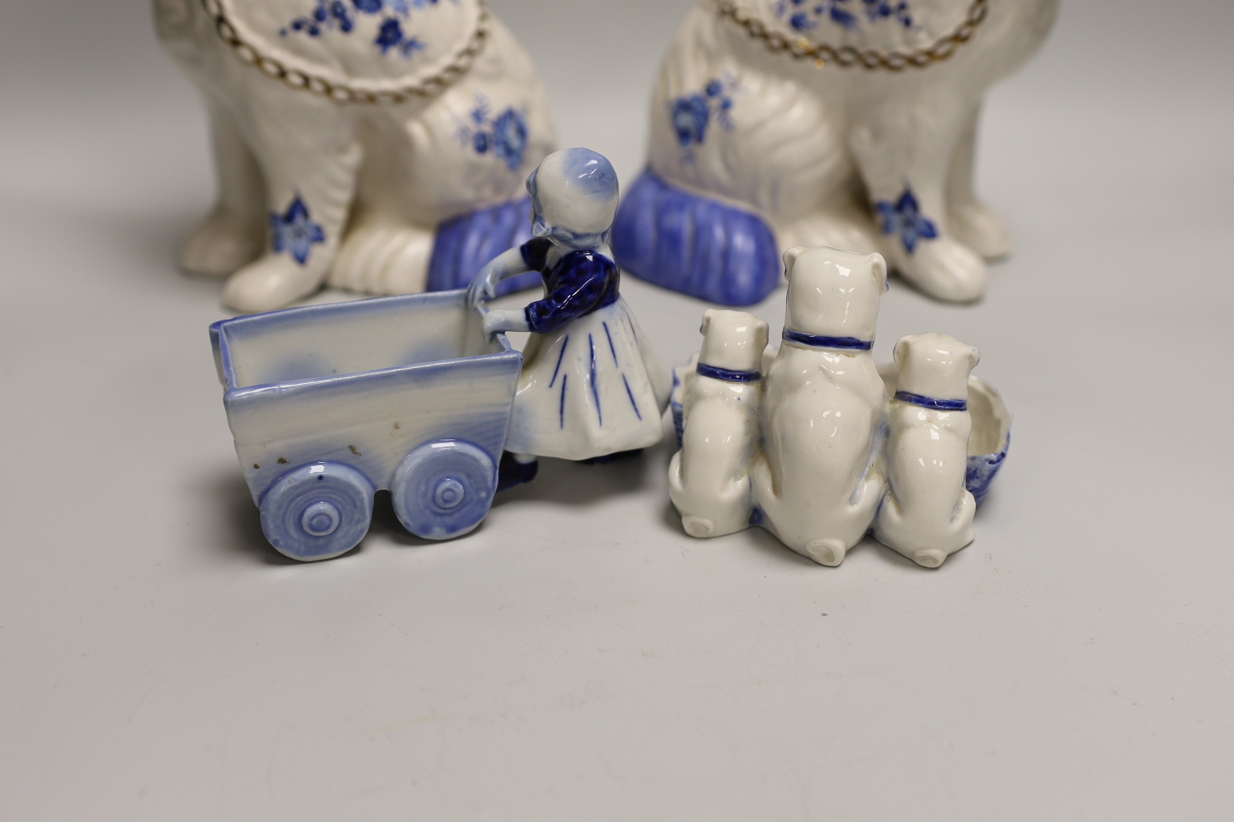 A pair of Staffordshire style comforter spaniels and two other items